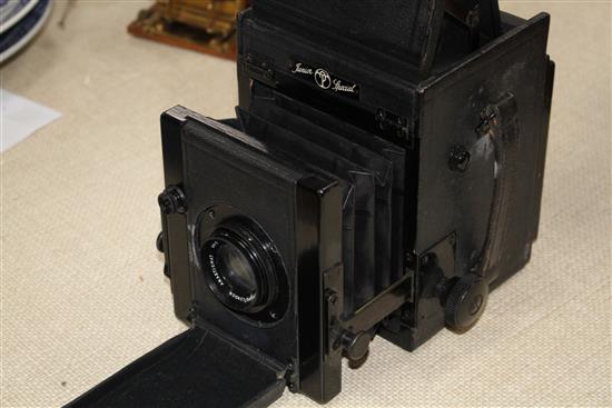 A Pickard Junior Special quarter plate camera with J H Dallmeyer lens, Anastigmat lens, height when closed 17cm, depth when closed 13cm